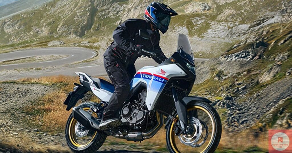 Front and side view of the Honda Transalp XL750 adventure motorcycle parked in a mountain terrain